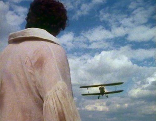 The fourth Doctor outruns a bi-plane